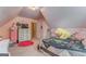 Bright bedroom with dormered ceiling, pink walls, and playful decor at 119 Creekside Vw, Hiram, GA 30141