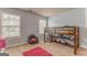 Comfortable bedroom features a wooden bunk bed, beanbag chair, and natural light at 119 Creekside Vw, Hiram, GA 30141