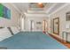 Bright primary bedroom with a trey ceiling, hardwood floors, and an open doorway to an adjoining bathroom at 119 Creekside Vw, Hiram, GA 30141