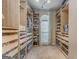 Large walk-in closet providing ample storage and organization solutions with custom shelving and drawers at 119 Creekside Vw, Hiram, GA 30141