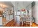Open concept kitchen and dining area with hardwood floors and lots of light at 119 Creekside Vw, Hiram, GA 30141
