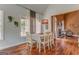 Bright dining room featuring hardwood floors, vaulted ceilings, and large windows for natural light at 119 Creekside Vw, Hiram, GA 30141