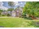 Charming two-story home with a stone facade and a well-manicured lawn at 119 Creekside Vw, Hiram, GA 30141