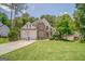 Charming two-story home with a well-manicured lawn, inviting curb appeal, and a three-car garage at 119 Creekside Vw, Hiram, GA 30141