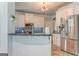 Modern kitchen with stainless steel refrigerator and breakfast bar seating at 119 Creekside Vw, Hiram, GA 30141