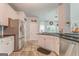 Well-lit kitchen featuring stainless steel appliances and white cabinets at 119 Creekside Vw, Hiram, GA 30141
