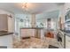 Bright kitchen featuring tile floors, stainless appliances, and eat-in area at 119 Creekside Vw, Hiram, GA 30141