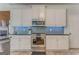 Updated kitchen featuring stainless steel appliances and tile backsplash at 119 Creekside Vw, Hiram, GA 30141