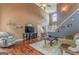 Open concept living room featuring hardwood floors, tall ceiling, and lots of light at 119 Creekside Vw, Hiram, GA 30141