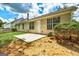 View of the patio and home's back exterior at 2898 Cedar Trace Dr, Ellenwood, GA 30294