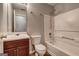 Bathroom features a sink and vanity, lighting, toilet, shower and tub combo, and a mirror at 2898 Cedar Trace Dr, Ellenwood, GA 30294