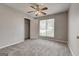 Comfortable bedroom with gray carpet, ceiling fan, and window for natural light at 2898 Cedar Trace Dr, Ellenwood, GA 30294