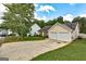 A quaint home features a two-car garage, tidy landscaping, and a well-maintained lawn at 2898 Cedar Trace Dr, Ellenwood, GA 30294