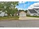 A well-kept home with a two-car garage and inviting landscaping, set in a quiet residential neighborhood at 2898 Cedar Trace Dr, Ellenwood, GA 30294