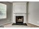 A decorative fireplace surround enhances the cozy ambiance of the home's living space at 2898 Cedar Trace Dr, Ellenwood, GA 30294