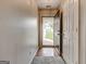 A well-lit entryway featuring hardwood flooring, neutral walls, and an open view to the outdoors at 2898 Cedar Trace Dr, Ellenwood, GA 30294