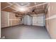 Spacious two-car garage featuring freshly epoxied floors at 2898 Cedar Trace Dr, Ellenwood, GA 30294