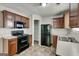 Well appointed kitchen with lots of storage space and black appliances at 2898 Cedar Trace Dr, Ellenwood, GA 30294