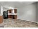 Cozy kitchen area featuring dark wood cabinets and modern black appliances at 2898 Cedar Trace Dr, Ellenwood, GA 30294