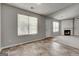 Living room has tile floors, a door, and a view into the carpeted living room with a fireplace at 2898 Cedar Trace Dr, Ellenwood, GA 30294