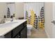 This bathroom offers a vanity and a shower with a decorative curtain at 4160 Grandview Vista St, Cumming, GA 30028
