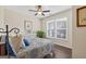 Cozy bedroom with large window, ceiling fan, wood flooring, and stylish decor at 4160 Grandview Vista St, Cumming, GA 30028