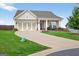 Inviting single-story home featuring a three-car garage, a well-maintained lawn and attractive landscaping at 4160 Grandview Vista St, Cumming, GA 30028