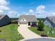 Charming front exterior with well-maintained lawn and inviting three-car garage at 4160 Grandview Vista St, Cumming, GA 30028