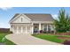 Charming single-story home with manicured lawn, three-car garage, and inviting front porch at 4160 Grandview Vista St, Cumming, GA 30028
