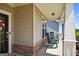 Cozy front porch with stone accents, rocking chairs, and a welcoming entrance at 4160 Grandview Vista St, Cumming, GA 30028