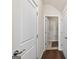 Hallway featuring hardwood floors and white paneled doors leading to other rooms at 4160 Grandview Vista St, Cumming, GA 30028