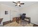Bright office space with a large window, ceiling fan, and a modern work setup at 4160 Grandview Vista St, Cumming, GA 30028
