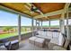 A covered patio with plenty of seating and natural light at 4160 Grandview Vista St, Cumming, GA 30028