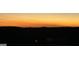 Calm sunset with faint orange tones above a silhouetted horizon, evoking tranquility at 4160 Grandview Vista St, Cumming, GA 30028