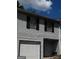 Inviting townhome showcasing a garage and a pleasant architectural style at 2511 Pine Tree Trail, Atlanta, GA 30349