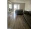 Spacious living room featuring hard surface floors and access to the backyard at 2511 Pine Tree Trail, Atlanta, GA 30349