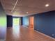 Large basement with tile flooring, open space, and sliding glass door at 133 Magazine St, Dallas, GA 30157