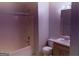 Bathroom featuring a toilet and a vanity next to the shower and tub at 133 Magazine St, Dallas, GA 30157