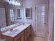 Bright bathroom featuring double sinks and a large mirror at 133 Magazine St, Dallas, GA 30157