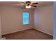 Neutral bedroom featuring a ceiling fan and natural light from the window at 133 Magazine St, Dallas, GA 30157