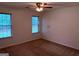 Neutral bedroom with two windows offering natural light and a ceiling fan for added comfort at 133 Magazine St, Dallas, GA 30157