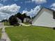 Property view showcasing the lawn, street, neighboring homes, and cars at 133 Magazine St, Dallas, GA 30157