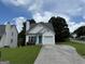 Charming single-Gathering home with a well-maintained front yard and a driveway leading to an attached garage at 133 Magazine St, Dallas, GA 30157