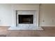 Close-up of a traditional fireplace with a white marble surround and hearth at 133 Magazine St, Dallas, GA 30157