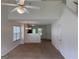 View of the living room showing open layout, high ceilings, and seamless flow into the kitchen area at 133 Magazine St, Dallas, GA 30157