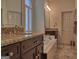 Bathroom with marble countertops, double vanity, and jacuzzi tub for relaxing at 183 Eagles Club Dr, Stockbridge, GA 30281