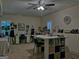 Bright craft room with ample workspace, storage, and a large ceiling fan at 183 Eagles Club Dr, Stockbridge, GA 30281