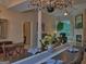 Open-concept dining area with elegant decor, seamlessly connecting to the living room and other interior spaces at 183 Eagles Club Dr, Stockbridge, GA 30281