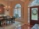 Well-appointed dining area featuring stylish lighting, detailed trim, and a seamless flow to other living spaces at 183 Eagles Club Dr, Stockbridge, GA 30281