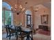 Formal dining room featuring elegant chandeliers, large windows, and sophisticated decor, creating a refined ambiance at 183 Eagles Club Dr, Stockbridge, GA 30281